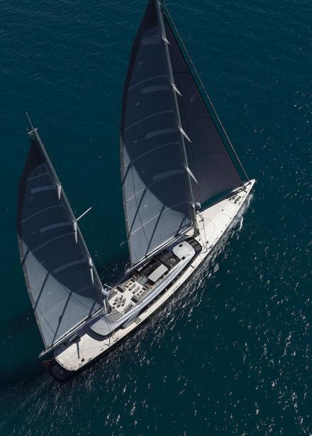 sails opened large luxury yacht